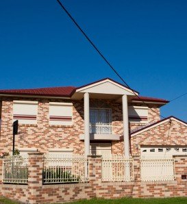 double storey brick home with blockout roller shutters