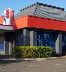 KFC store with blue window shutters